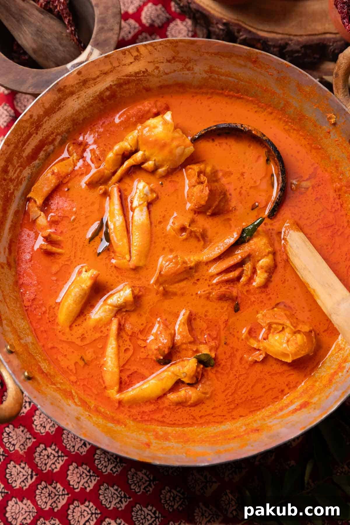 Mangalore's Fiery Crab Feast 2 Mangalorean crab curry in a kadai with ladle