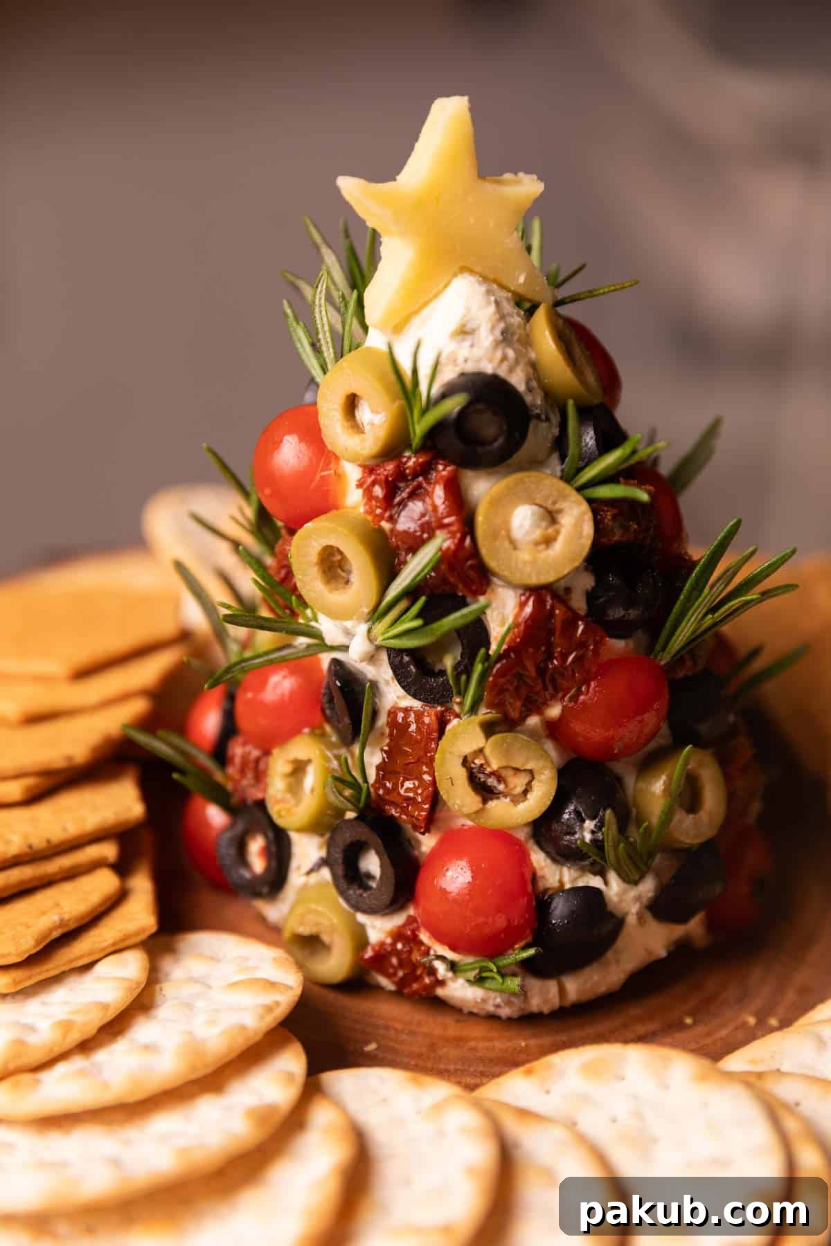 Festive Cream Cheese Tree 3 A close-up view of the festive Cheese Ball Christmas Tree, highlighting its vibrant decorations and inviting texture.
