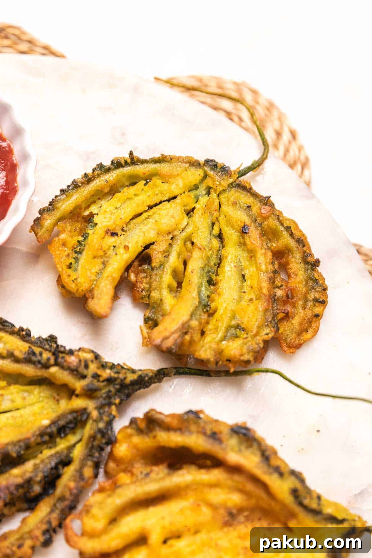 Crispy Bitter Gourd Bites 3 Close-up of crispy Karela pakoda showing its crunchy texture and golden brown color