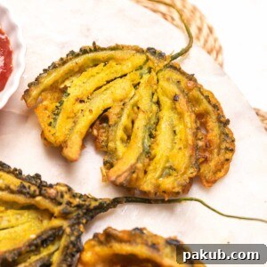 close up of karela pakoda to show it's crispy texture