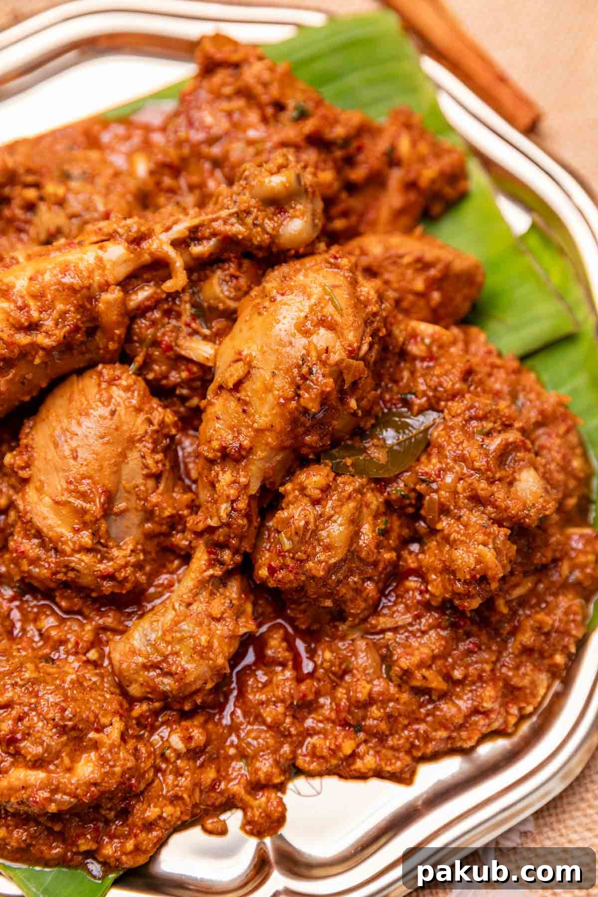 Spicy Mangalorean Chicken Sukka 2 A vibrant platter of Mangalorean Chicken Sukka, garnished with fresh coriander, ready to be served, showing its semi-dry texture.