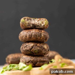 raw banana tikki or Kachhe kele ke kebab garnished and served on a brown board