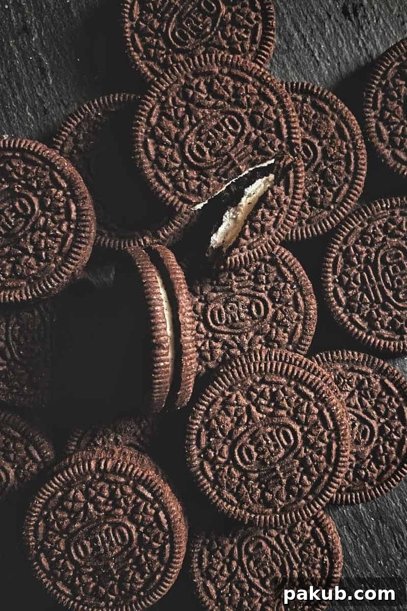 Secrets to Ever-Crisp Biscuits 3 A simple yet elegant shot of delicious Oreo-style chocolate sandwich biscuits, perfectly stacked and ready to be enjoyed, highlighting their crisp texture.