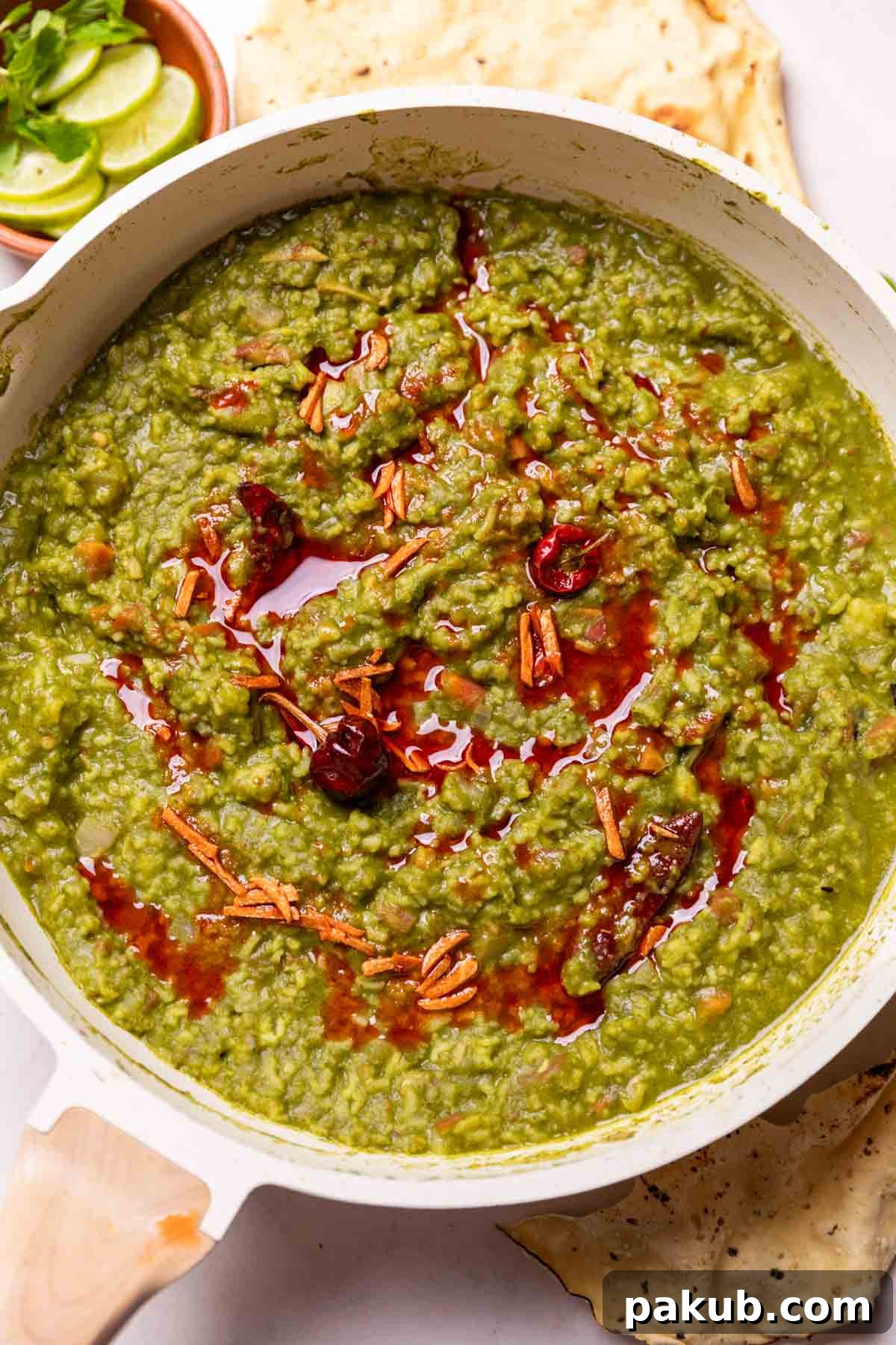 A close-up image of a steaming bowl of Palak Khichdi, showcasing its rich green color and creamy texture, ready to be enjoyed.