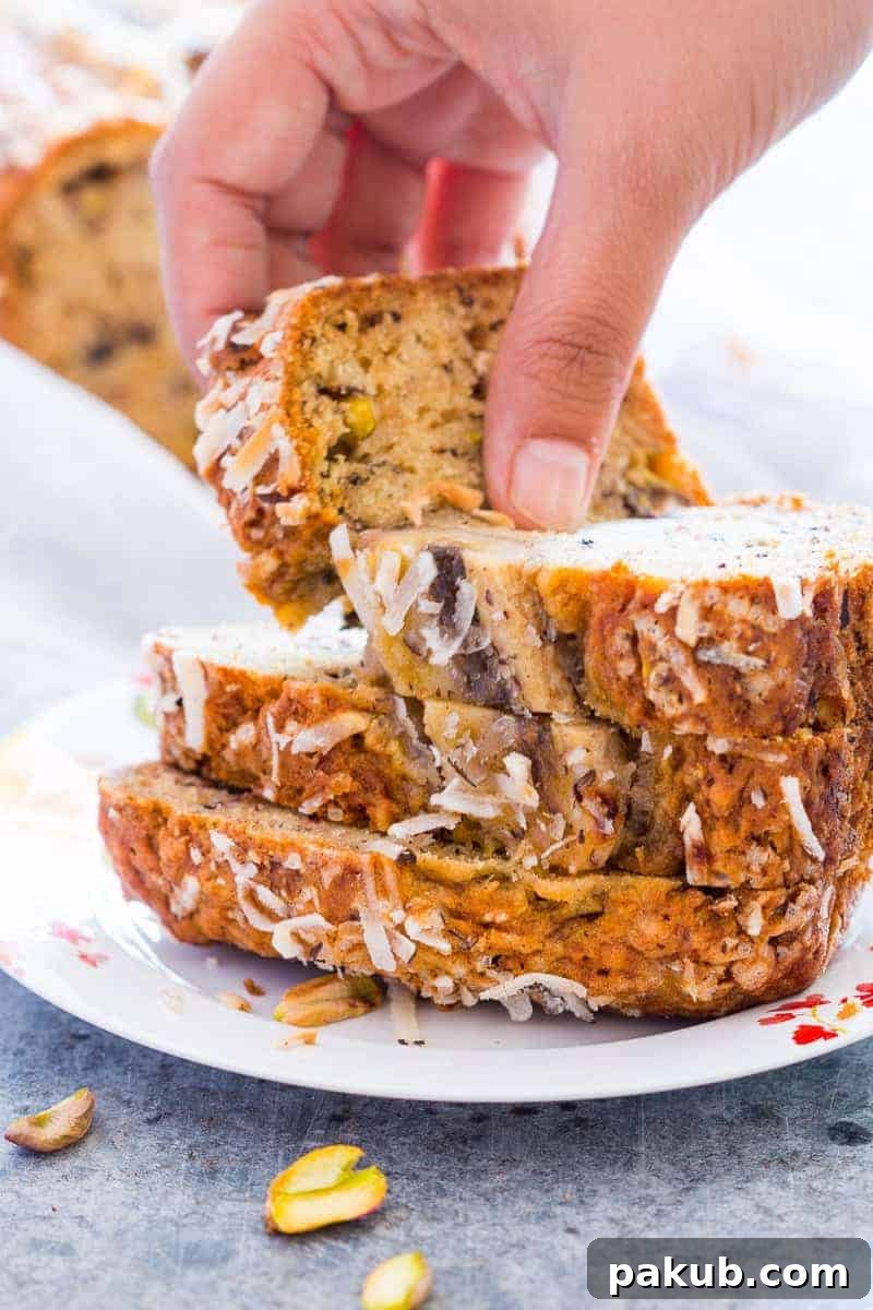 Freshly Baked Coconut Pistachio Banana Bread A freshly baked Quick Coconut Pistachio Banana Bread loaf cooling on a wire rack, ready to be sliced and enjoyed.