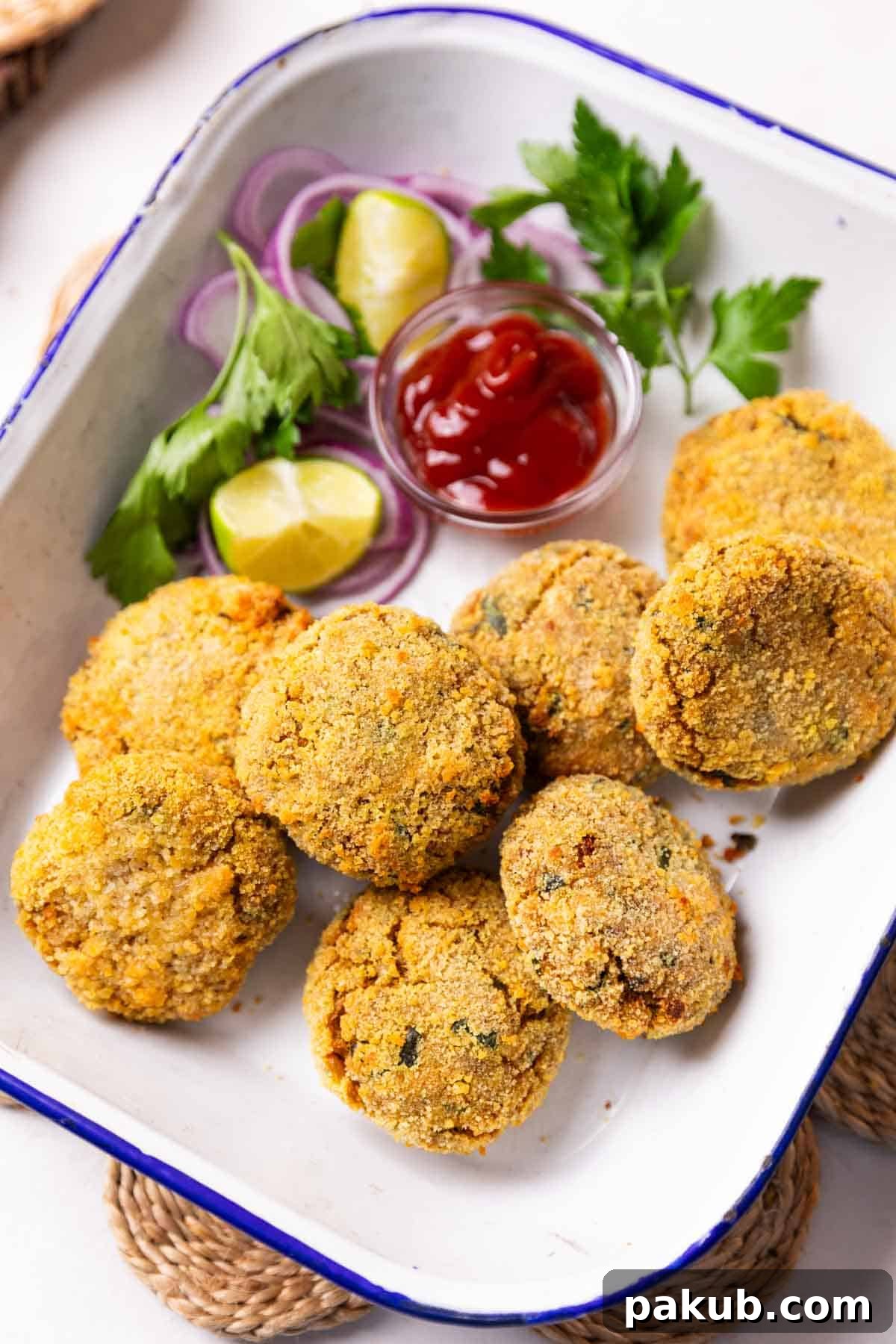 air fryer cutlet served in a white dish with accompaniments
