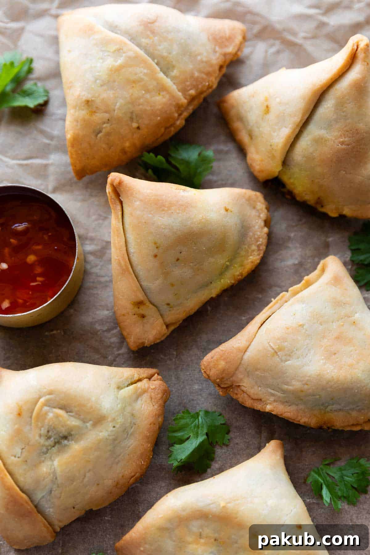 Guilt-Free Air Fryer Aloo Samosas 3 Close-up of golden brown Air Fryer Aloo Samosas with ketchup