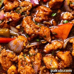 Close up of Chicken Manchurian to show its texture and glossy sauce