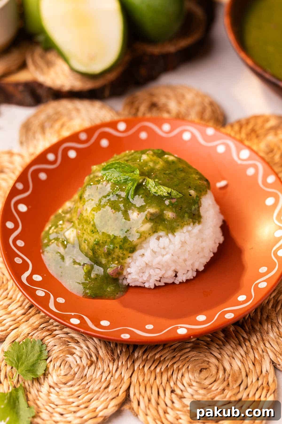 Himachali Echoes 2 A refreshing bowl of Himachali Mahni poured over steamed rice, showcasing its vibrant color and tempting texture.