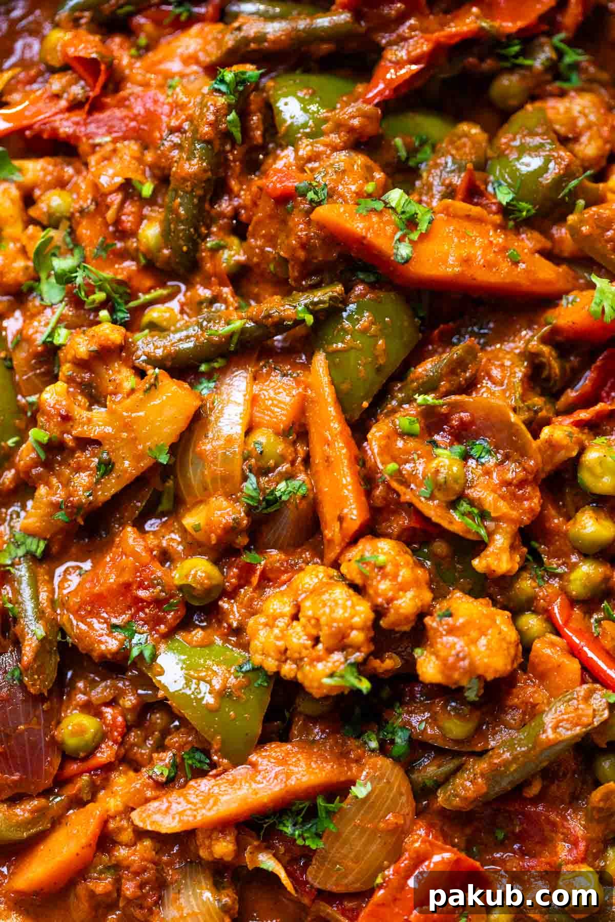 Spicy Kadai Vegetables 3 A close-up view of the rich and creamy Veg Kadai curry, showcasing its texture, vibrant colors, and the fresh coriander garnish.