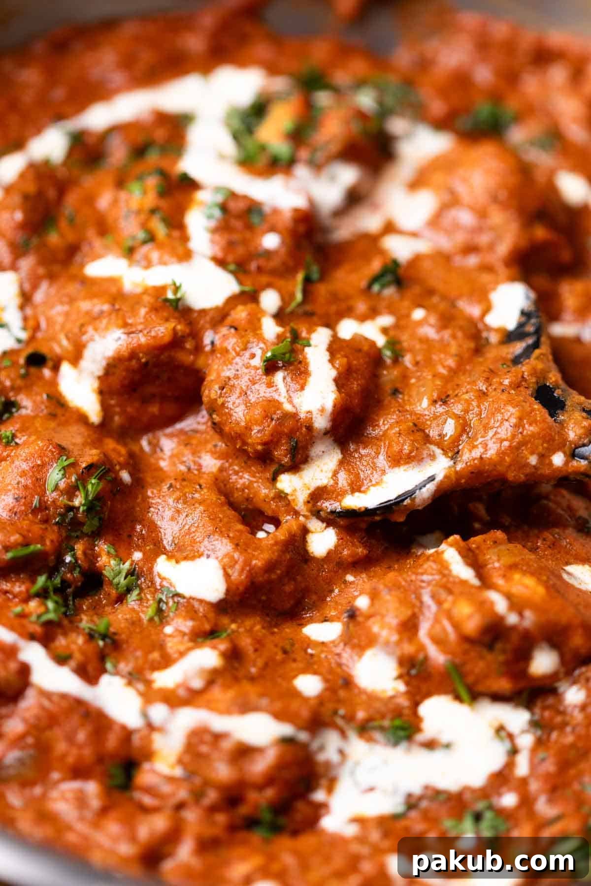 A close-up image of creamy, rich 30-minute butter chicken, showcasing its vibrant color and smooth texture