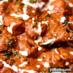 A close-up image of 30 minutes butter chicken, highlighting its creamy texture and rich color