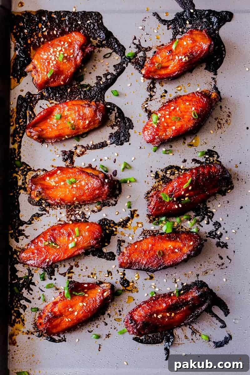 Crispy, perfectly glazed Korean Baked Gochujang Chicken Wings, ready to be devoured.