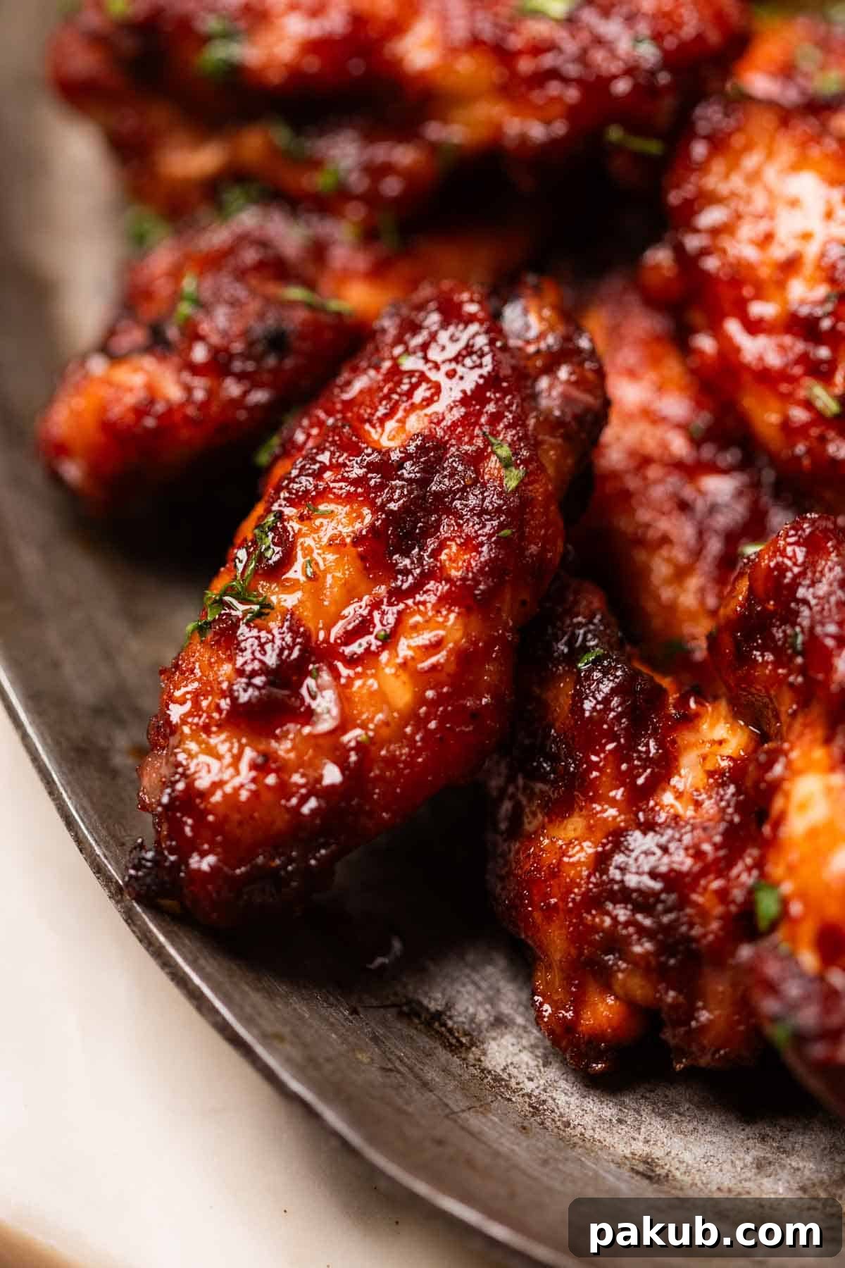 Fiery Air Fryer BBQ Chicken Wings 2 Close-up of perfectly glazed and crispy Air Fryer Spicy BBQ Chicken Wings, showcasing their rich color and tantalizing texture, ready to be served.