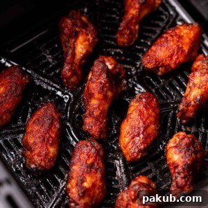 Air Fryer Spicy BBQ Chicken Wings, perfectly cooked and glistening with sauce.