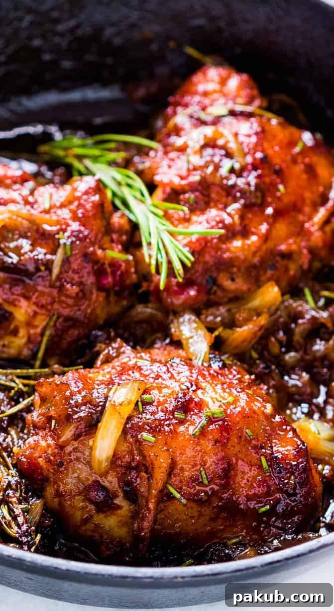 Platter of One-Pan Caramelized Onion Rosemary Chicken Thighs, perfectly cooked and garnished, ready to serve and impress.