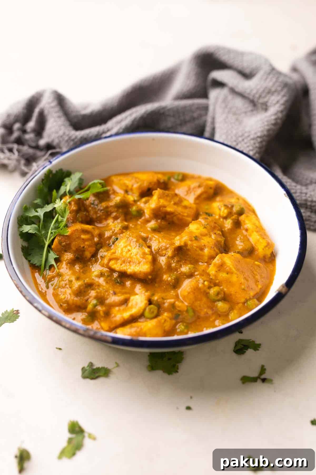 Velvety Matar Paneer Delight 2 A delectable bowl of creamy Matar Paneer curry, garnished with fresh coriander, ready to be served.