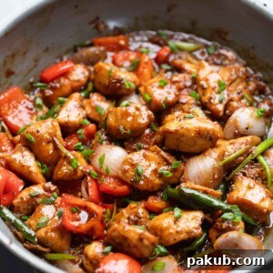 Bold Black Pepper Chicken 6 Close up of Black Pepper Chicken being cooked in a pan