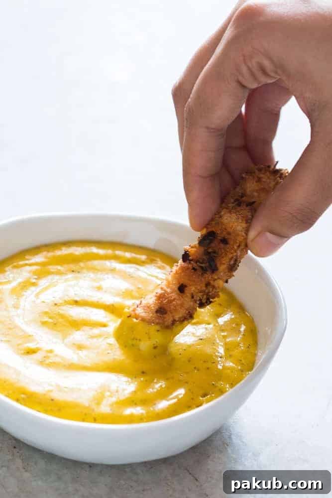Luscious Blender Mango Mustard Dipping Sauce A second perspective of the creamy, vibrant tropical mango mustard dipping sauce, highlighting its luscious texture and inviting color. Ideal for various snacks and party foods.