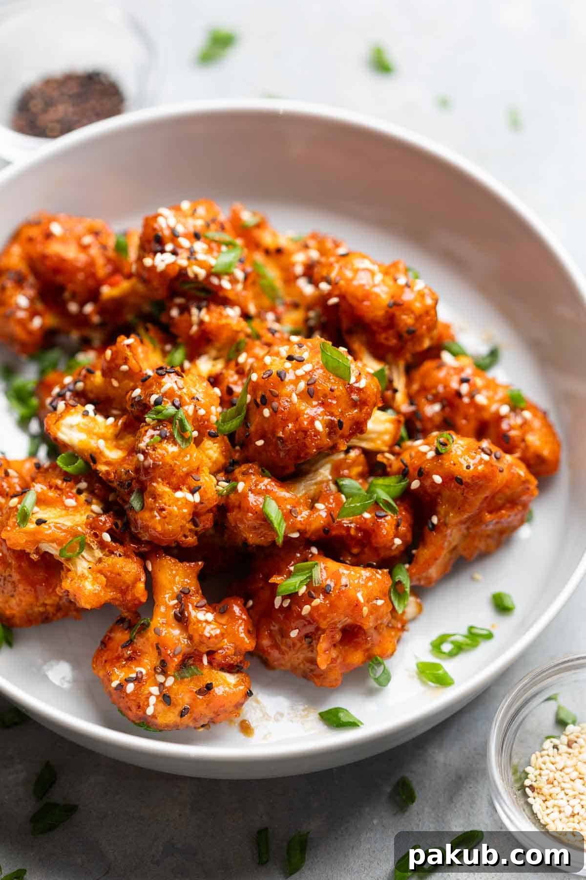 Crispy Air Fryer Bang Bang Cauliflower 2 air fryer bang bang caulifower served on a white plate