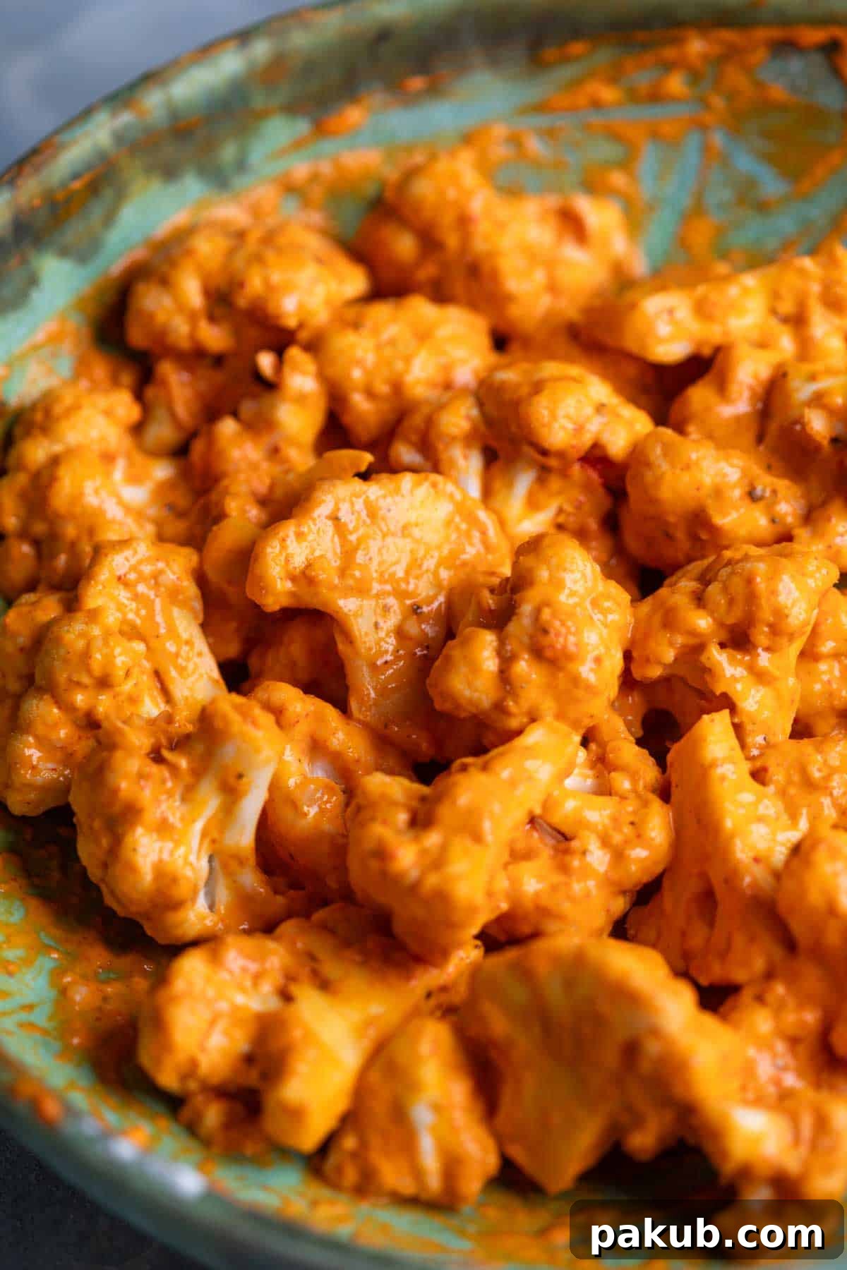 Crispy Air Fryer Bang Bang Cauliflower 3 marinated cauliflower florets ready for frying