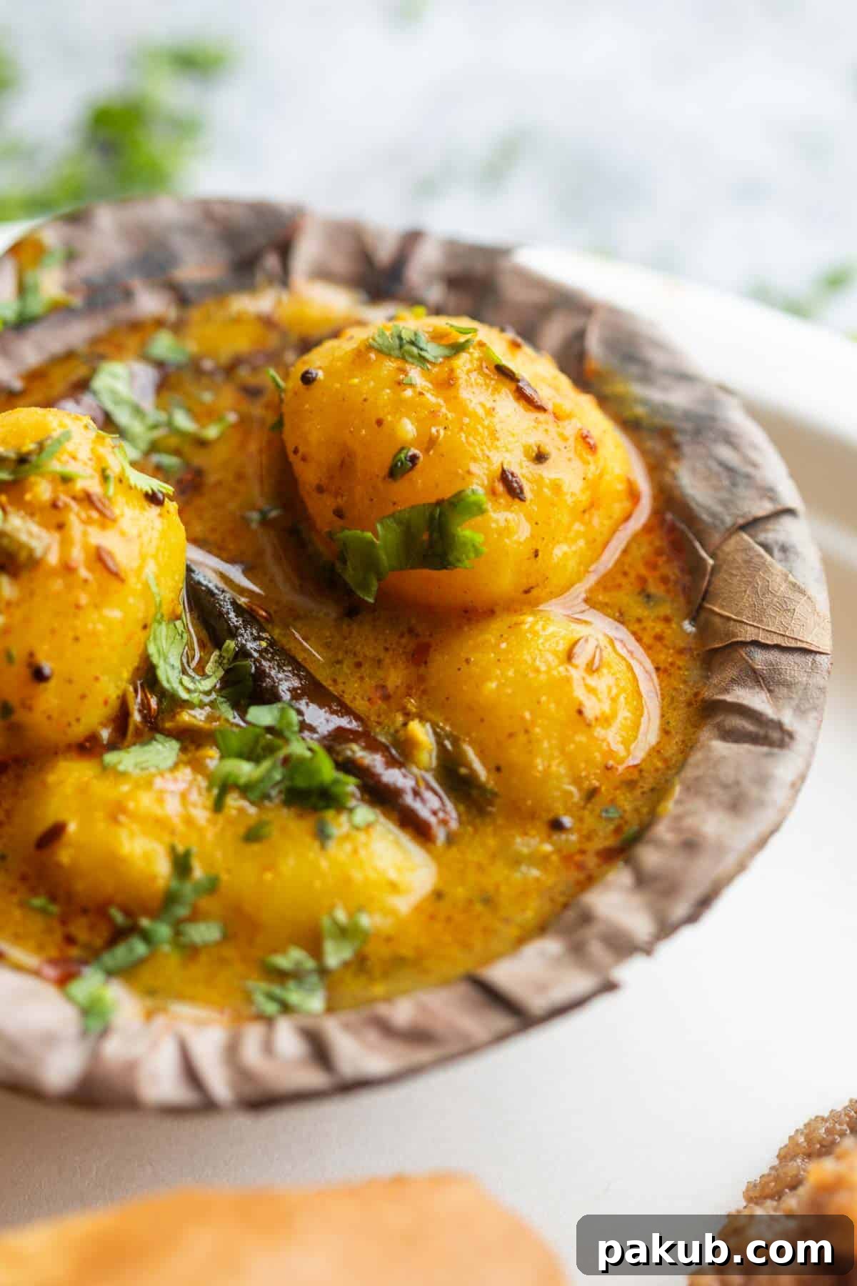 Wholesome Fasting Potatoes 2 A vibrant bowl of Dahi Wale Aloo, a creamy yogurt and potato curry, garnished with fresh herbs, perfect for fasting days.