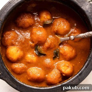Mangalorean Ripe Mango Curry, beautifully presented in a traditional clay pot.