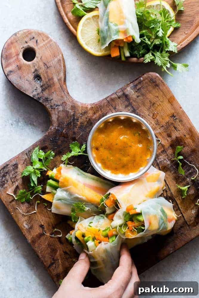 Vibrant Mango Bell Pepper Rice Paper Rolls filled with fresh vegetables, perfectly displayed as a healthy summer appetizer.