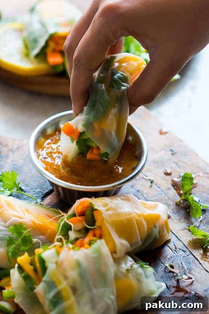 A bowl of vibrant Mango Cilantro Dipping Sauce, ready to be paired with fresh summer rolls.