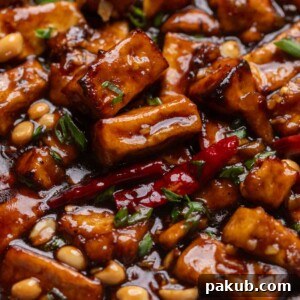 An appetizing image showcasing the final Kung Pao Tofu dish, with its vibrant colors and glossy sauce.
