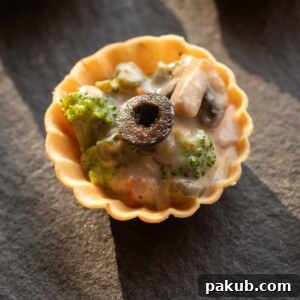 A close-up of veg canapés to show its creamy texture and vibrant ingredients.