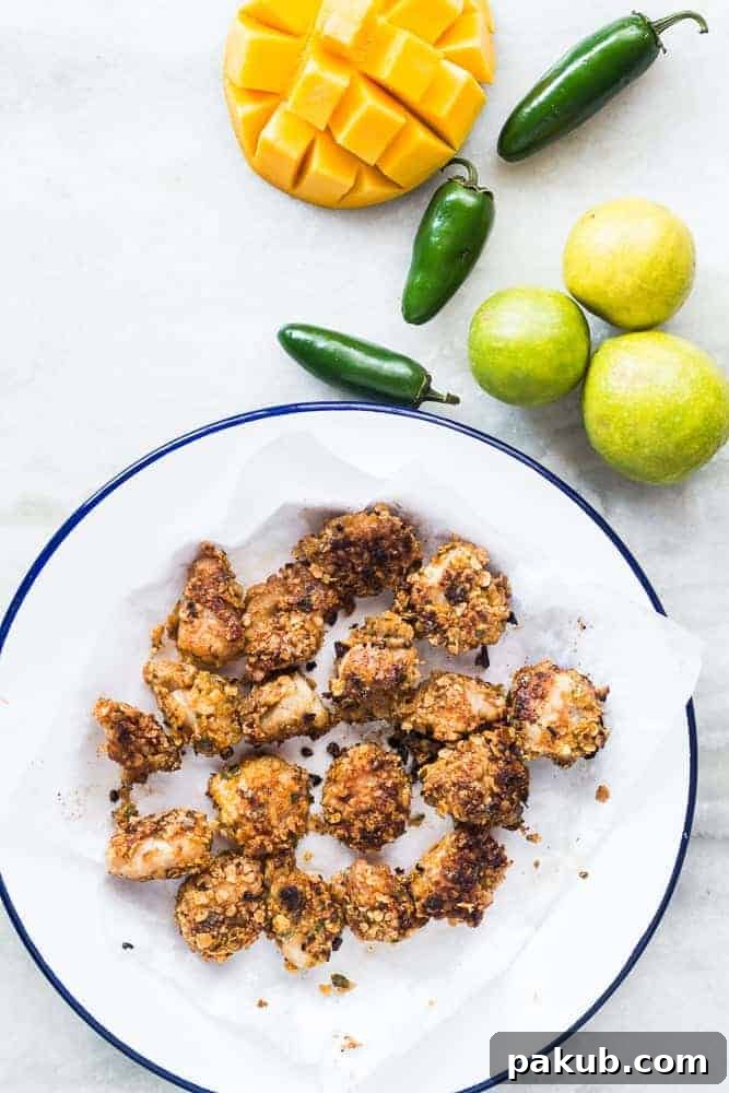A plate of freshly prepared oats-crusted fish tacos with a generous side of bright mango salsa, highlighting the quick preparation time and fresh ingredients.