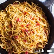 Simple 5-Ingredient Bacon Aglio Olio Spaghetti 2 The spaghetti in a cast iron pan.