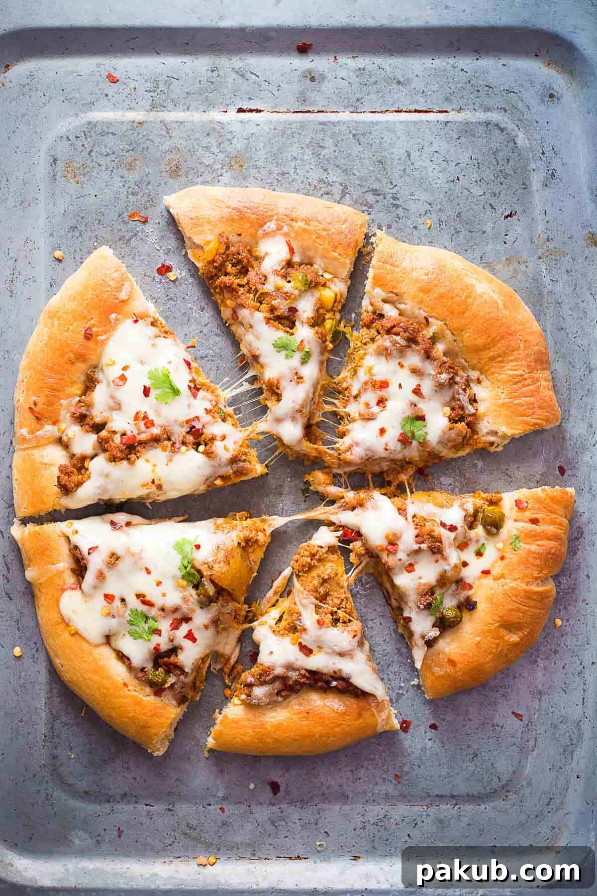 Wholesome Keema Lamb Pizza 2 Delicious Wholewheat Keema (Spiced Minced Lamb) Pizza in a tray, ready to be served