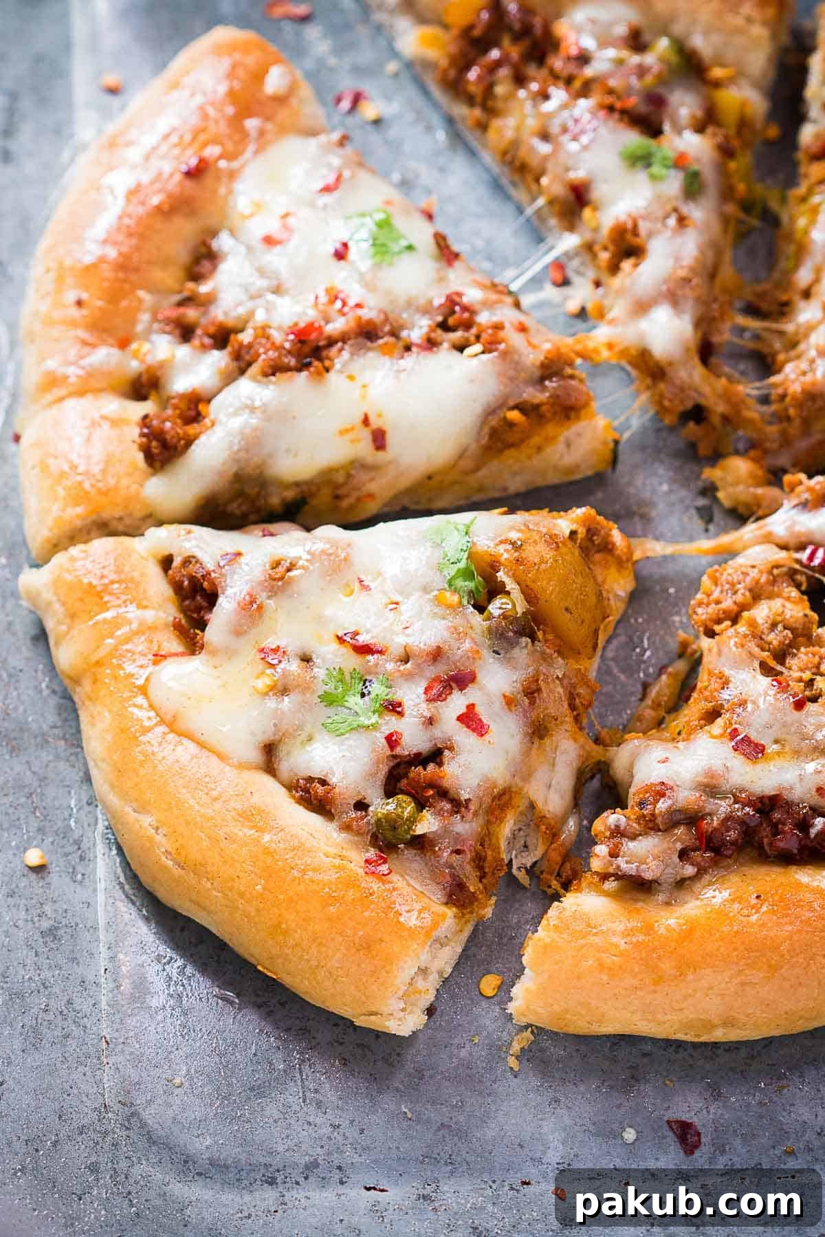 Wholesome Keema Lamb Pizza 5 Close-up shot of a freshly baked, sliced Wholewheat Keema Spiced Minced Lamb Pizza