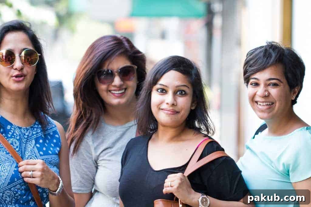 A joyful picture of me and three other friends, smiling and posing together, capturing a memorable moment during our trip to Bangkok
