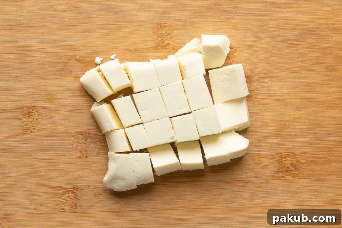 Creamy Restaurant Style Paneer Butter Masala 4 A slab of paneer cut into cubes
