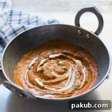 The curry base in a large pan/ kadhai.