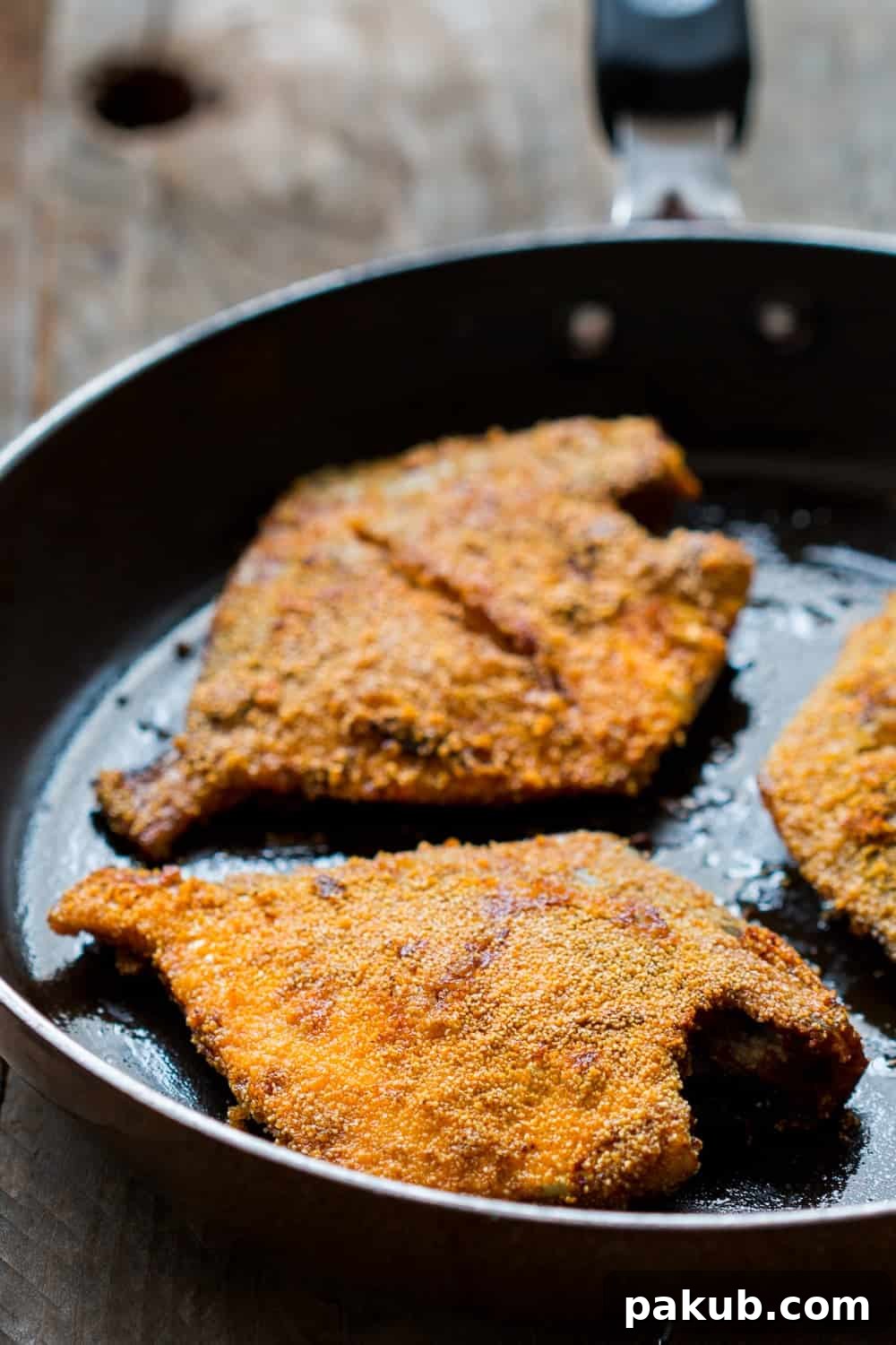 Perfectly Fried Rava Pomfret Golden-brown Mangalorean Rava Pomfret Fish Fry on a plate, ready to serve
