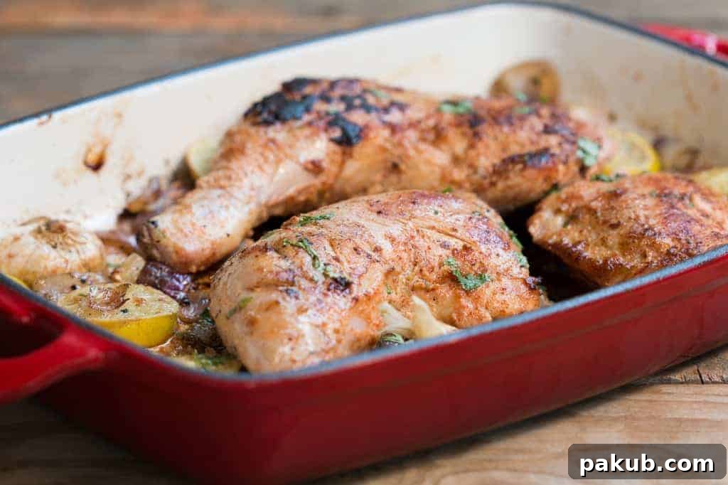 Sumac Chicken in a vibrant red pan, ready to serve sumac chicken in a red pan