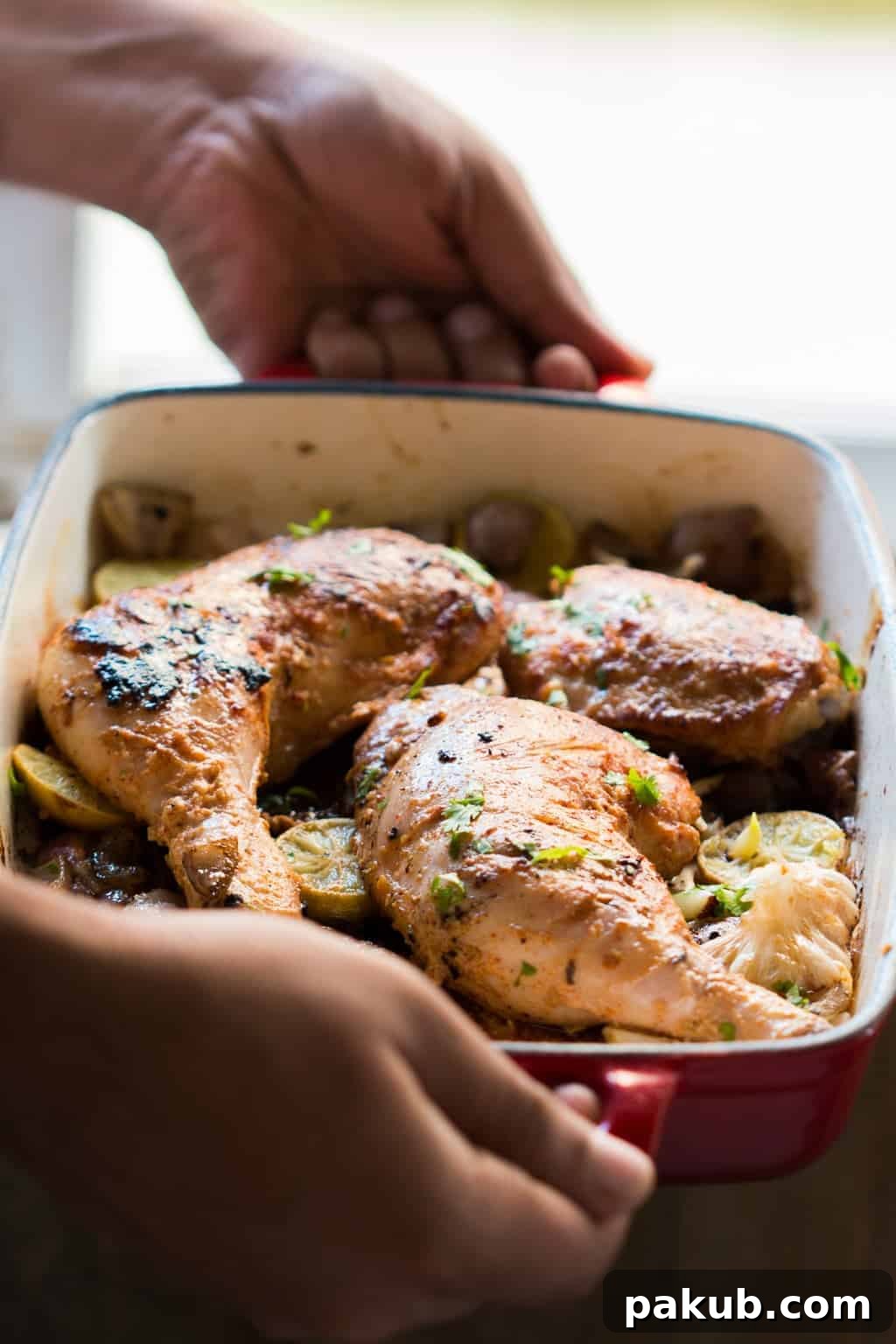 Close-up of perfectly cooked Sumac Chicken, glistening with flavor sumac chicken in a red pan