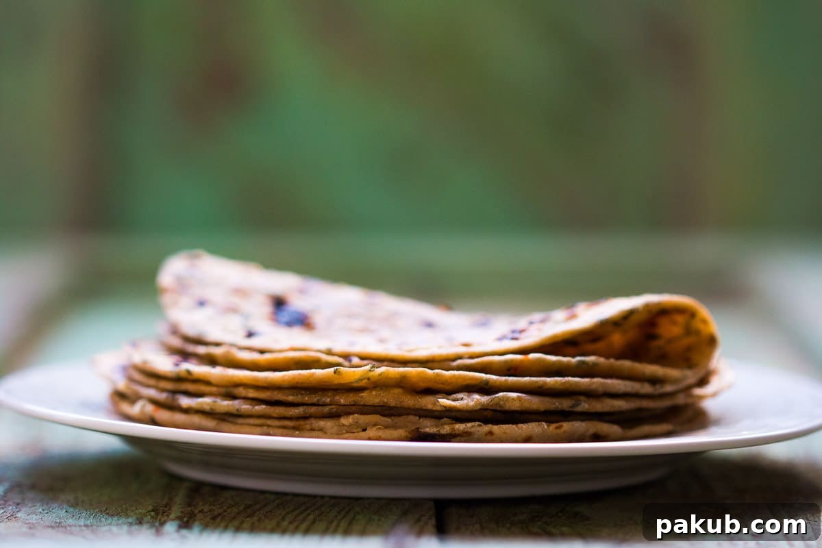 Aromatic Kasuri Methi Flatbread 2 Freshly cooked warm Kasuri Methi Parathas, a healthy and comforting Indian flatbread perfect for any meal.