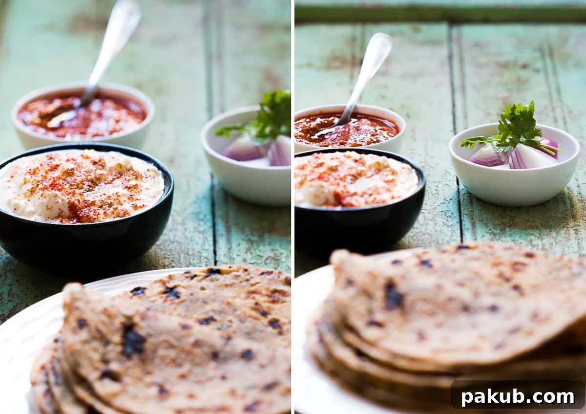 Aromatic Kasuri Methi Flatbread 4 Delicious Kasuri Methi Parathas presented with creamy flavored curds, fresh onions, and a classic Indian pickle.