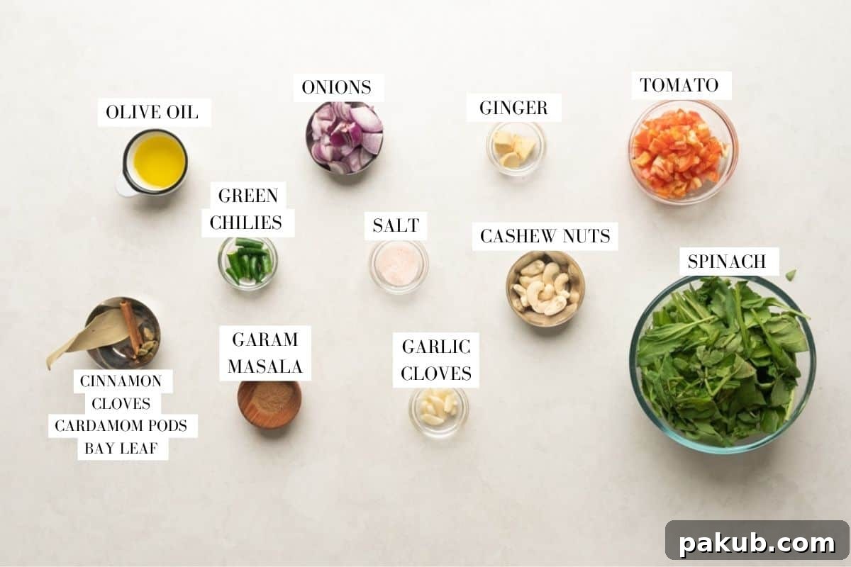Picture of ingredients for the curry base of Palak Paneer Kofta Curry, including onions, tomatoes, ginger, garlic, and cashews.