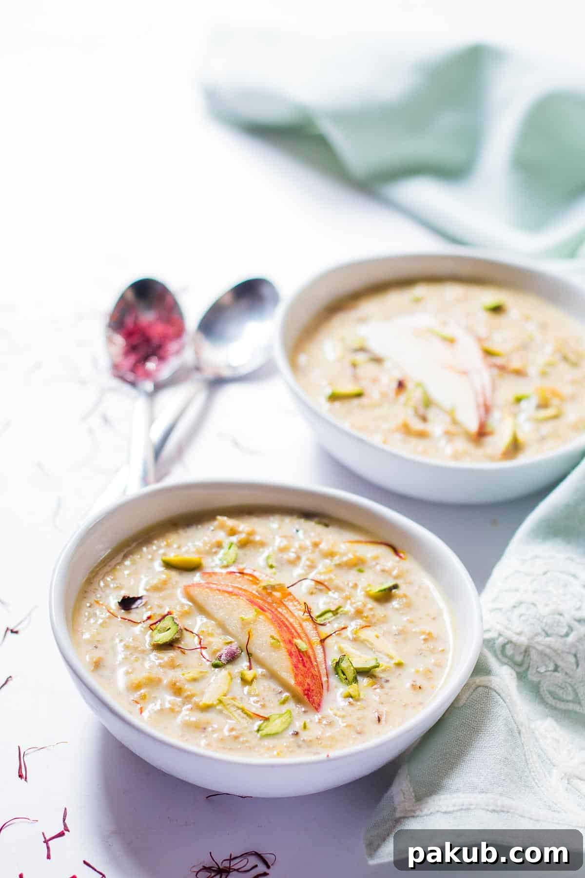 Wholesome Apple Quinoa Pudding 3 The finished Healthy Quinoa Apple Kheer beautifully garnished with fresh apple slices and finely chopped pistachios, ready to be served.