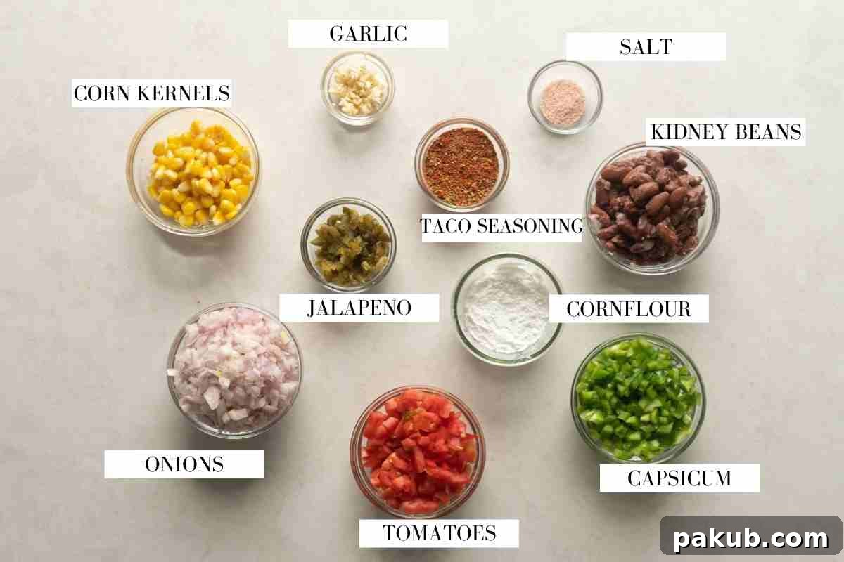 Mexican Plant-Based Bean Fiesta Soup 3 A flat lay photograph showcasing all the fresh and canned ingredients needed for vegetarian Mexican soup, neatly arranged on a white background with descriptive labels.