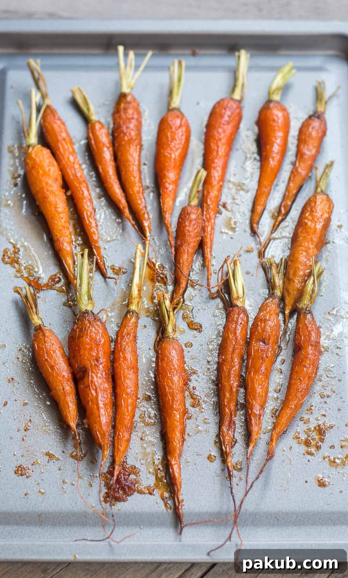 Golden-brown, perfectly roasted carrots fresh out of the oven, ready to be served.