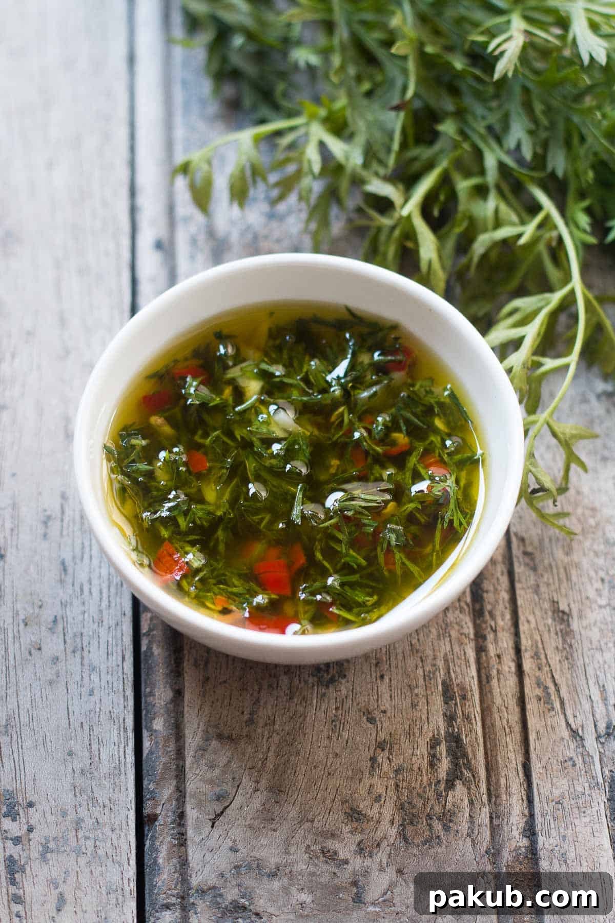 Close-up of the fresh, green Chimichurri, made from carrot greens, a delicious and sustainable alternative.
