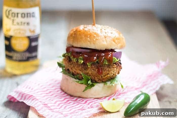 Fully Loaded Veggie Burger A delicious fully loaded veggie burger with avocado mint chutney on a bun