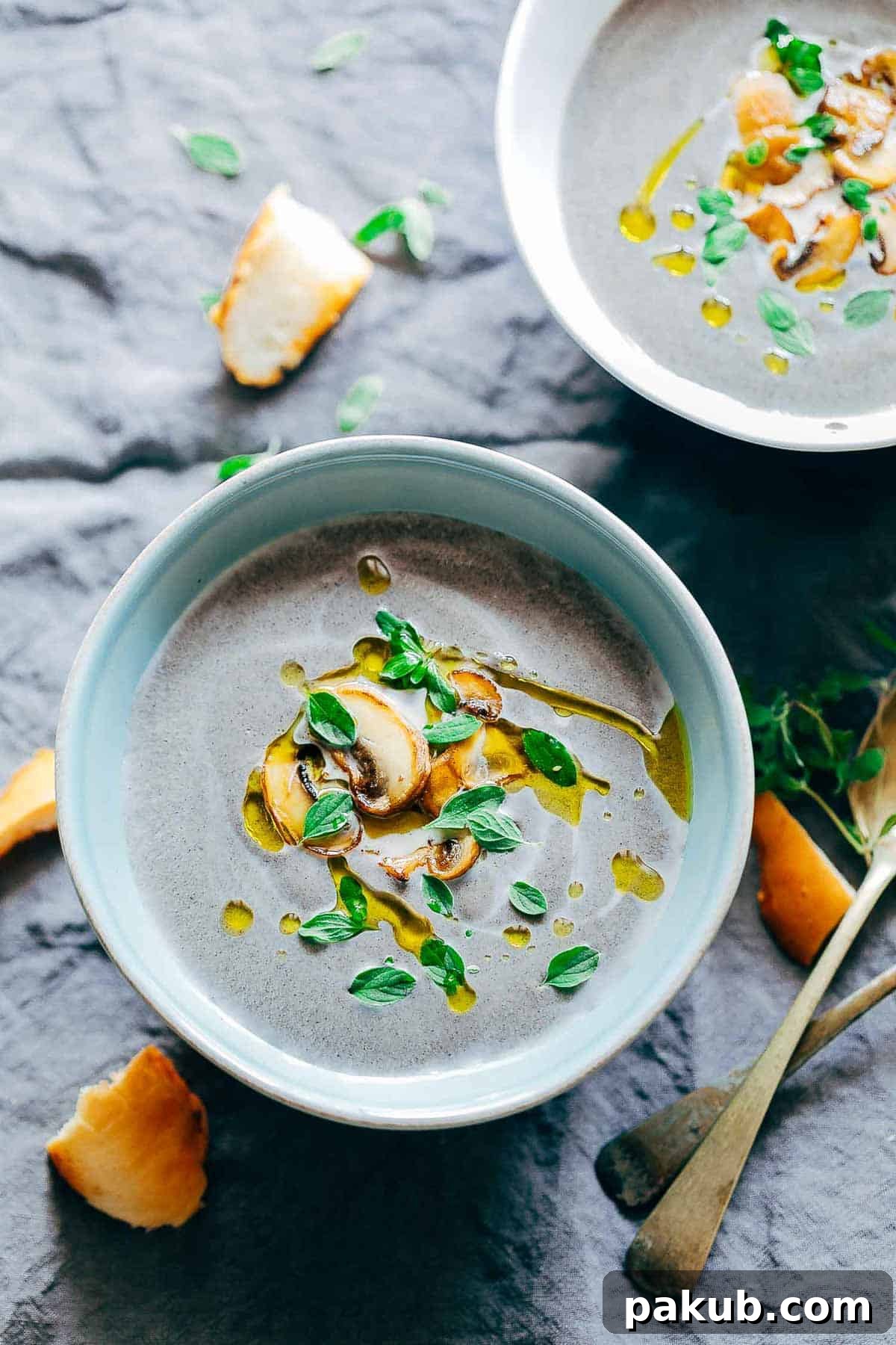 A vibrant bowl of healthy creamy mushroom soup, garnished beautifully, waiting to be enjoyed.